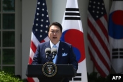 South Korean President Yoon Suk Yeol speaks during a news conference with US President Joe Biden in the Rose Garden of the White House in Washington, DC, on April 26, 2023. (Photo by Jim WATSON / AFP)