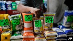 A vendor displays rice at a flea market in Maracaibo, Venezuela, July 22, 2024.