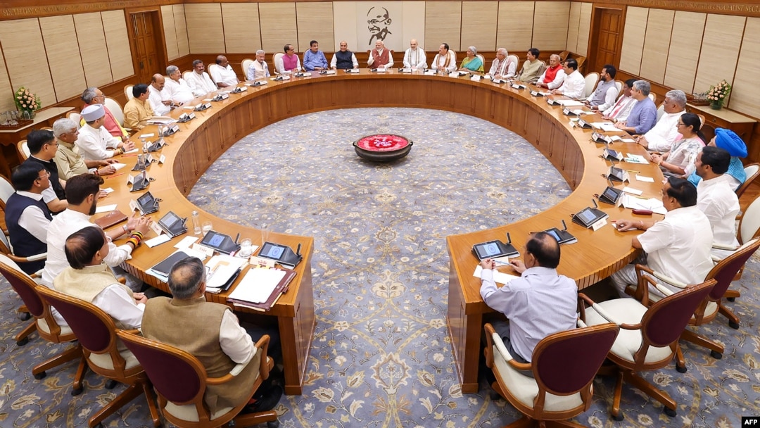 India's Prime Minister Narendra Modi, center, holds the first cabinet meeting after naming a new cabinet, in New Delhi, in this handout photograph taken June 10, 2024 by the Indian Press Information Bureau.