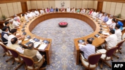 India's Prime Minister Narendra Modi, center, holds the first cabinet meeting after naming a new cabinet, in New Delhi, in this handout photograph taken June 10, 2024 by the Indian Press Information Bureau.