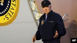 President Joe Biden walks down the steps of Air Force One at Dover Air Force Base in Delaware, July 17, 2024. Biden was returning to his home in Rehoboth Beach, Del., to self-isolate after testing positive for COVID-19.