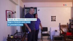 Pareja de migrantes venezolanos llega a Caracas para votar en presidenciales