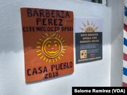 Entrance to the Perez Barbershop, one of the first businesses in Adjuntas to start operating with solar energy after Hurricane María in 2017. (Salome Ramirez/VOA)