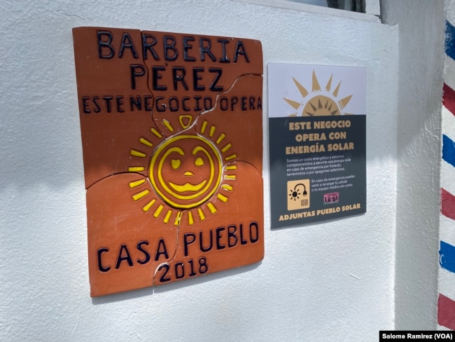 Entrance to the Perez Barbershop, one of the first businesses in Adjuntas to start operating with solar energy after Hurricane María in 2017. (Salome Ramirez/VOA)