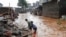 Residents sift through the rubble as they recover their belongings after the Nairobi river burst its banks and destroyed their homes within the Mathare Valley settlement in Nairobi, Kenya, April 25, 2024.