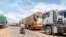 FILE—A long line of trucks is seen queuing at the closed border brossing between Benin and Niger in the town of Malanville on September 18, 2023.