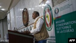 Head of the African Union Election Observation Committee and former Kenyan President Uhuru Kenyatta addresses a press conference organized by the Economic Community of West African States (ECOWAS) and the AU at the ECOWAS headquarters in Abuja, Nigeria, Feb. 27, 2023.