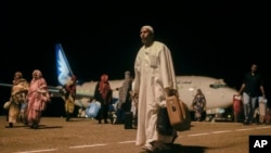 Sudanese, who had been stranded in Jeddah, Saudi Arabia, arrive at Port Sudan airport, Thursday, May 11, 2023.