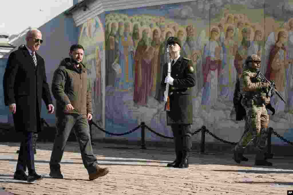 President Joe Biden walks with Ukrainian President Volodymyr Zelenskyy at St. Michael's Golden-Domed Cathedral on a surprise visit, Feb. 20, 2023, in Kyiv. 