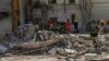 Rescue workers clear the rubble at the site of Okhmatdyt children's hospital hit by Russian missiles a day earlier, in Kyiv, Ukraine, July 9, 2024.