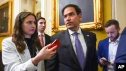 FILE - Sen. Marco Rubio, R-Fla., speaks with reporters as he walks, Feb. 28, 2024, at the Capitol in Washington. 