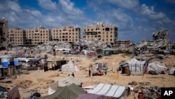 Palestinians displaced by the Israeli air and ground offensive on the Gaza Strip flee Hamad City after an evacuation order by the Israeli army to leave parts of the southern area of Khan Younis, Aug. 11, 2024.