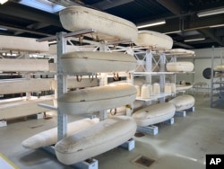 Dutch startup Loop Biotech's cocoon-like coffins, grown from local mushrooms and up-cycled hemp fibres, designed to dissolve into the environment, are stored in Delft, May 22, 2023.