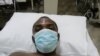 Obert Dube in hospital soon after he was beaten up by police in Victoria Falls