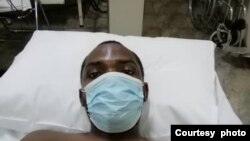 Obert Dube in hospital soon after he was beaten up by police in Victoria Falls