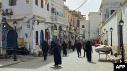 (FILE) People walk in the Old City of Tripoli, Apr. 27, 2024. 