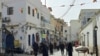 FILE - People walk in the Old City of Tripoli, Apr. 27, 2024. The UN high commissioner for human rights presented Tuesday a stinging rebuke of the methods employed by Libya’s governing elite to eviscerate its political opponents and remain in charge.