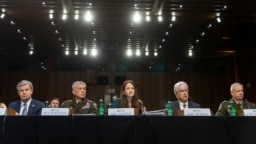 Top U.S. intelligence officials, with Director of National Intelligence Avril Haines in the center, appear before a Senate Intelligence Committee hearing to examine worldwide threats, at the Capitol in Washington, March 8, 2023.