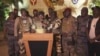 This image from video shows the spokesperson for Gabon's mutinous soldiers speaking on state television as he announces that the military had seized power in Libreville, Aug. 30, 2023. (GABON 24 via AP)