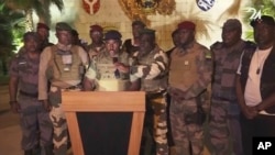 This image from video shows the spokesperson for Gabon's mutinous soldiers speaking on state television as he announces that the military had seized power in Libreville, Aug. 30, 2023. (GABON 24 via AP)