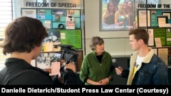In this undated photo, a student journalist interviews free speech activist Mary Beth Tinker in Washington.