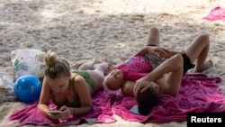 Russian tourists enjoy the beach in Phuket, Thailand, Dec. 26, 2022.