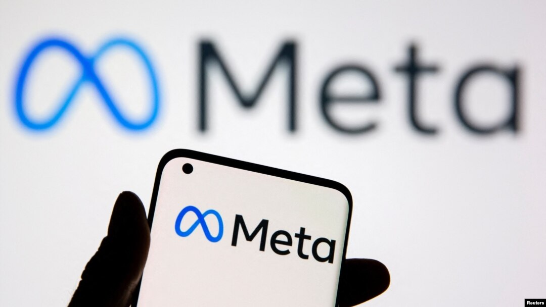 FILE - A smartphone with Meta logo is seen in front of displayed Facebook's new rebrand logo Meta in this illustration taken Oct. 28, 2021. 