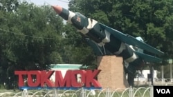 A Soviet-era fighter plane was installed at the entrance Tokmok, a town in Kyrgyzstan, July 7, 2024.