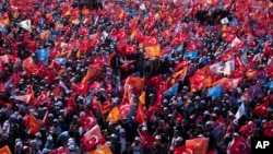 Supporters of President Recep Tayyip Erdogan attend an election rally campaign in Istanbul, Turkey, Sunday, May 7, 2023. (AP Photo/Khalil Hamra)