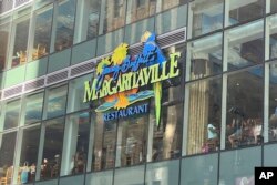 A sign is displayed for the Margaritaville restaurant in New York's Times Square on Sept. 2, 2023, following news of the death of Jimmy Buffett.