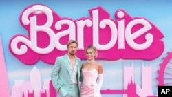 FILE - Ryan Gosling and Margot Robbie pose for photographers upon arrival at the premiere of the film 'Barbie' on July 12, 2023, in London.