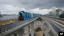 People ride on a new Lagos blue line train service in Lagos, Nigeria on Monday, Sept. 4, 2023.