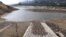 A measuring bar is exposed by the low water level in the San Rafael reservoir in La Calera, Colombia, April 8, 2024. Bogota will start rationing water this week to alleviate droughts wrought by the El Nino weather pattern.