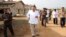FILE - In this undated photo provided on July 23, 2020, by the North Korean government, North Korean leader Kim Jong Un visits a chicken farm being built in Hwangju County, North Korea.