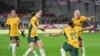 FILE - Australia's Sam Kerr, second right, celebrates with teammates after scoring against England during their women's international friendly soccer match in London, April 11, 2023.