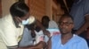 FILE - A man receives a shot of yellow fever vaccine at Kiswa Health Center III in Kampala, Uganda, April. 2, 2024.