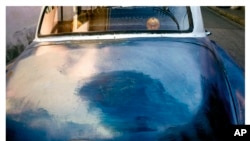 This photo provided by the Brandywine Conservancy and Museum of Art shows Frank Stewart's "Blue Car, Havana," which is part of a retrospective celebrating the photographer's work on display through Sept. 22, 2024, at the museum in Chadds Ford, Pa.