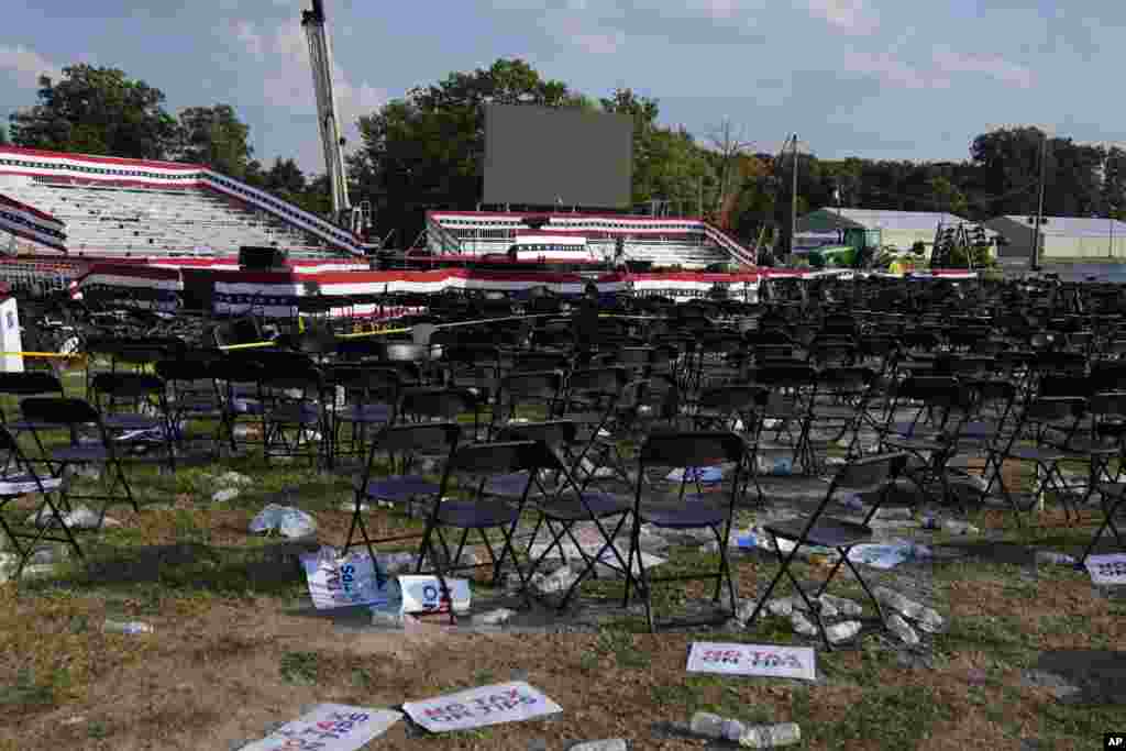 The campaign rally site is empty and littered with debris following the shooting.