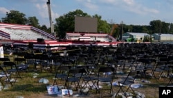 A campaign rally site for Republican presidential candidate former President Donald Trump is empty and littered with debris following an assassination attempt targeting him, July 13, 2024, in Butler, Pennsylvania.