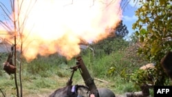 Ukrainian marines of the 35th Brigade fire a 120mm mortar towards Russian positions in the recently liberated village of Storozheve in the Donetsk region, on June 21, 2023, amid the Russian invasion of Ukraine.