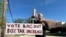 Rob Romeijn protests property taxes outside Rockdale County offices in Conyers, Ga., on April 23, 2024. Romeijn says the increase in the taxable value of his house is unfair.