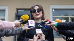 FILE - Journalist Naran Unurtsetseg speaks to reporters outside a court in Mongolia's capital, Ulaanbaatar, on May 28, 2024. 