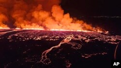 This image provided by Iceland Civil Defense shows lava erupting from a volcano between Hagafell and Stóri-Skógfell, Iceland, March 16, 2024. 