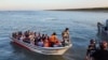 Some Rohingya Muslim refugees and Bangladeshi officials on a boat return after visiting Myanmar's Rakhine State as part of an effort to encourage their voluntary repatriation, in Teknaf, Cox's Bazar, Bangladesh, May 5, 2023. 