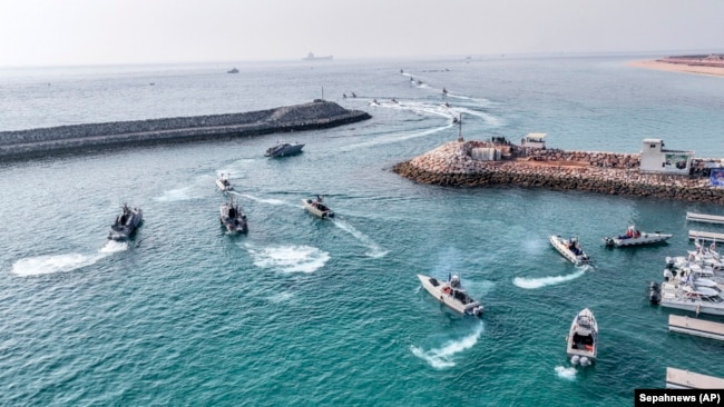 In this photo released, Aug. 2, 2023, by Sepahnews of the Iranian Revolutionary Guard, the Guard's speedboats move during a drill in the Persian Gulf.