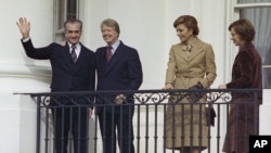 FILE - The Shah of Iran, Mohammad Reza Pahlavi, President Jimmy Carter, Empress Farah Pahlavi and U.S. first lady Rosalynn Carter are pictured on a balcony at the White House in Washington, Nov. 15, 1977.