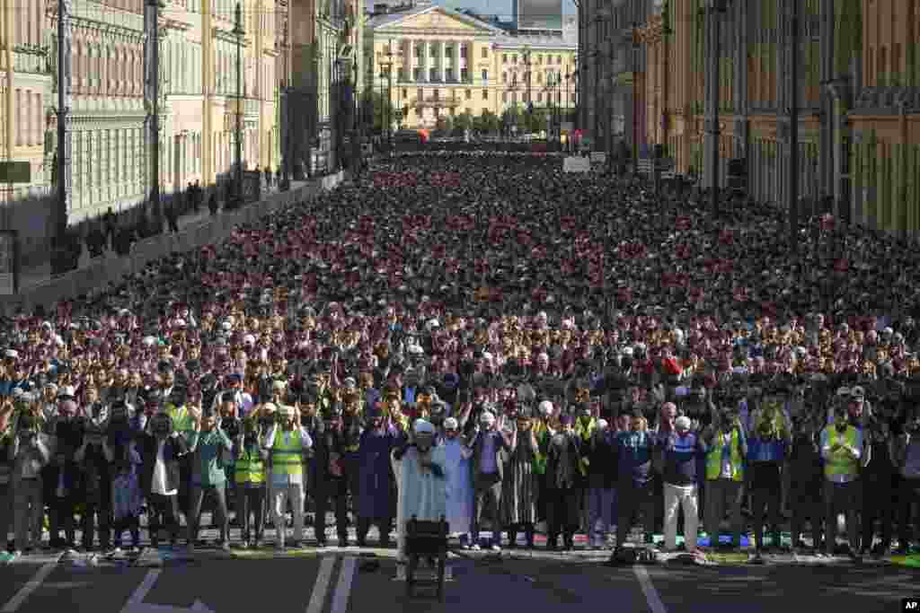 Muslims offer Eid al-Adha prayers at the Moskovsky central avenue during celebrations in St. Petersburg, Russia.