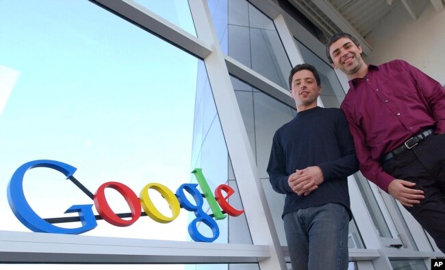 In this file photo, Google co-founders Sergey Brin, left, and Larry Page pose at company headquarters Jan.15, 2004, in Mountain View, Calif. (AP Photo/Ben Margot, File)