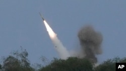 A U.S. M142 High Mobility Artillery Rocket System (HIMARS) fires a missile during a joint military exercise called "Balikatan," Tagalog for shoulder-to-shoulder in a Naval station in Zambales province, northern Philippines, April 26, 2023.