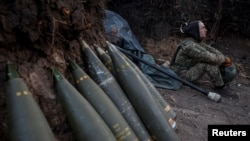 FILE - A soldier prepares an M777 howitzer to fire at Russian troops in the Donetsk region of Ukraine on April 20, 2024.  (Radio Free Europe/Radio Liberty/Serhii Nuzhnenko, Reuters)